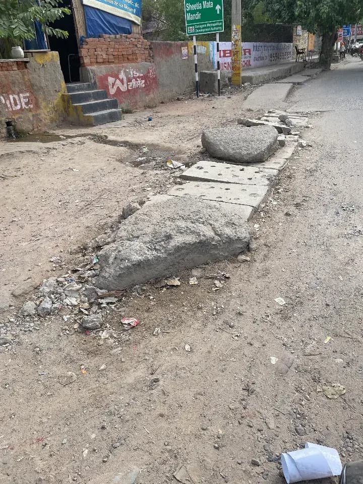 damaged footpath in Rajiv Nagar