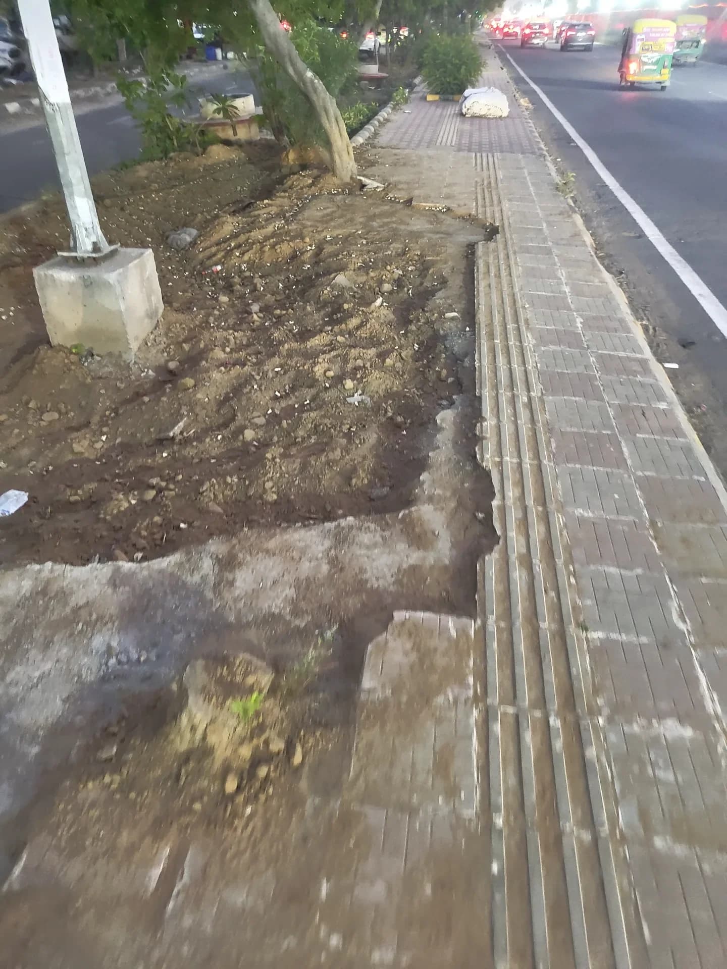 broken sidewalk in Institutional Area