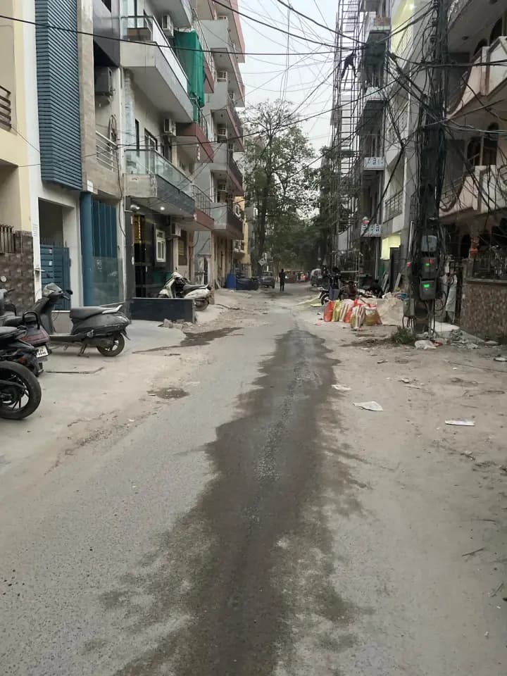damaged road in Sushant Lok Phase I
